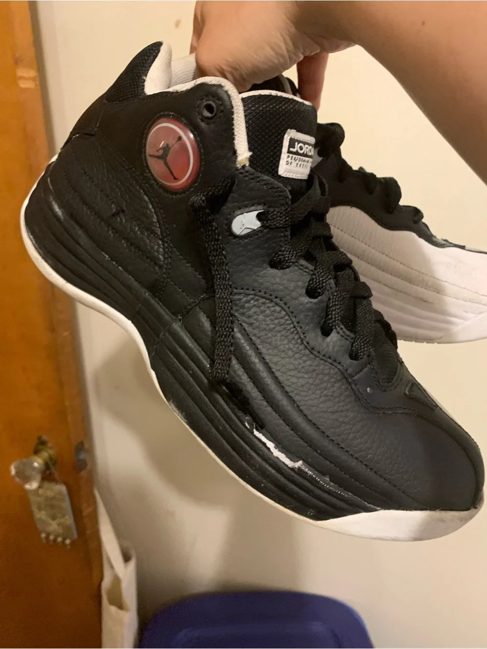 Jordan Black Sneakers with Red Jumpman Accent